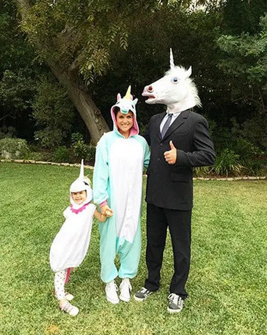 Tiffani Thiessen wearing a blue unicorn Kigurumi with her family